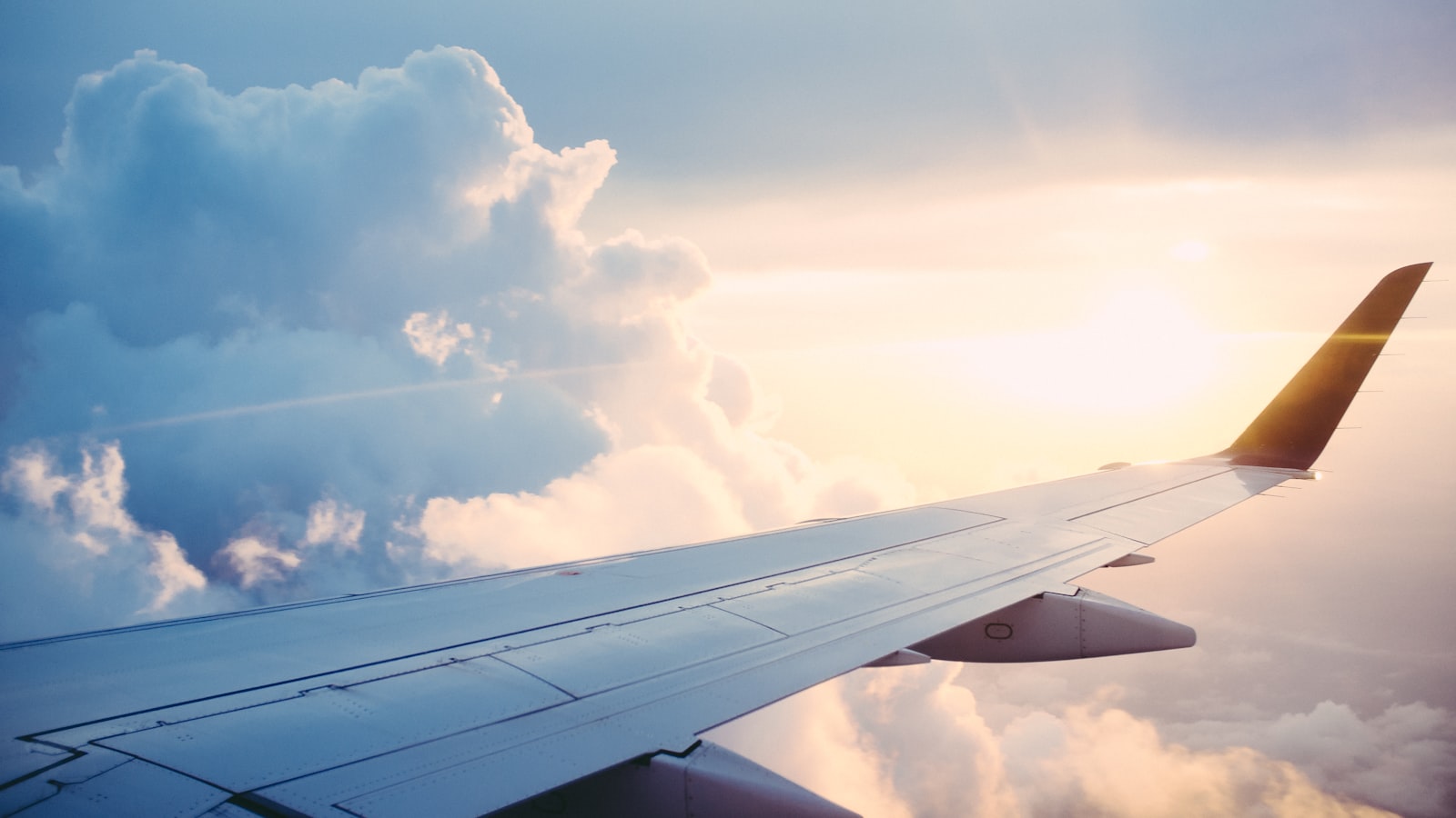 Airplane window over clouds — the trip looks fine until it isn’t